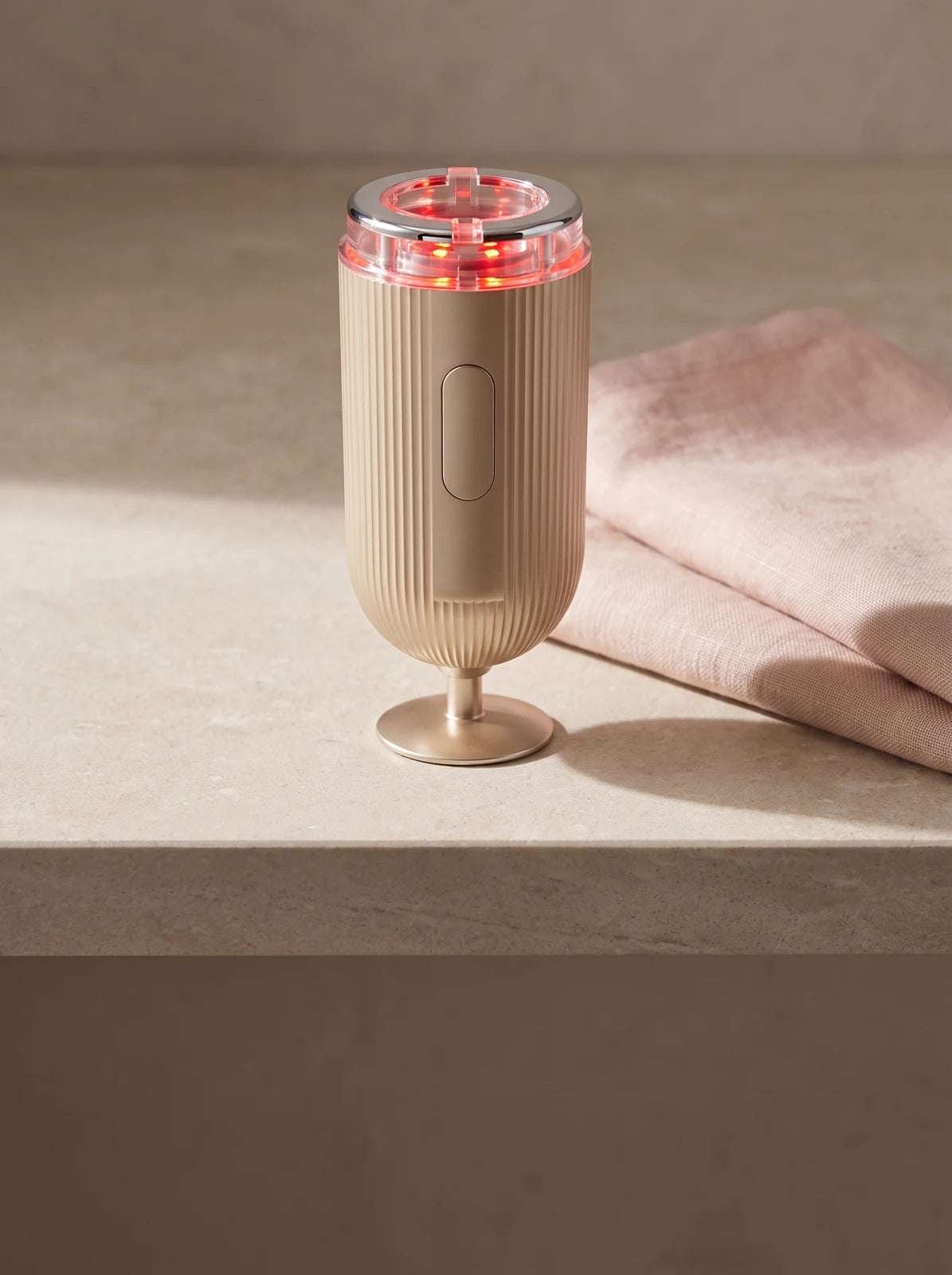 Champagne-gold FLOW+ on a bathroom vanity